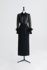 High-waisted textured skirt with back slit and sleek tailored silhouette